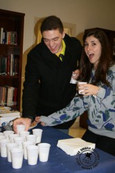 Students enjoying mild and cookies in the Umbra Library.