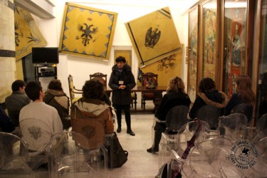 Students visit the contrada museum of L'Aquila.